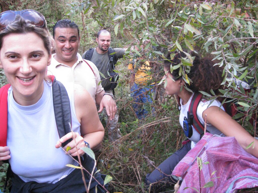 travelers with backpack, going through the jungle
