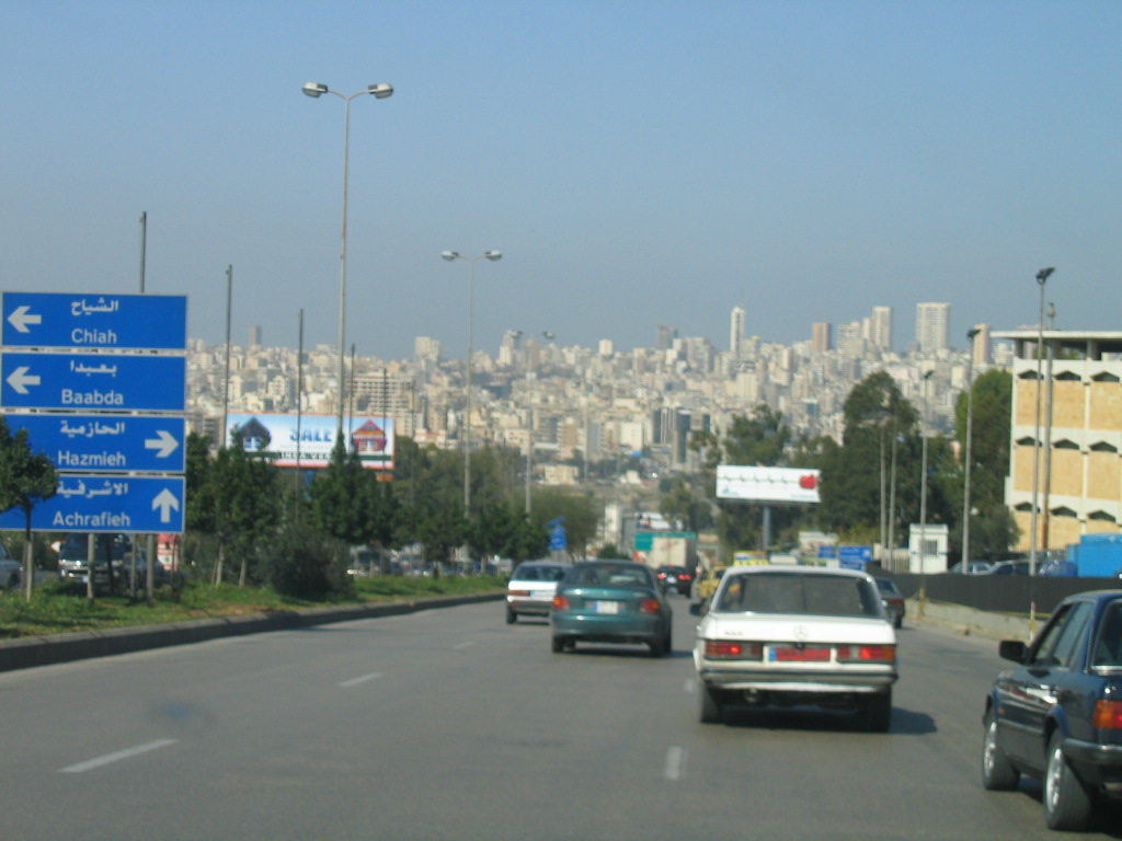 A road with a view of the city skyline