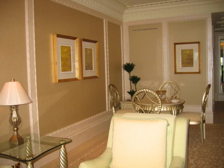 A gold themed hotel room
